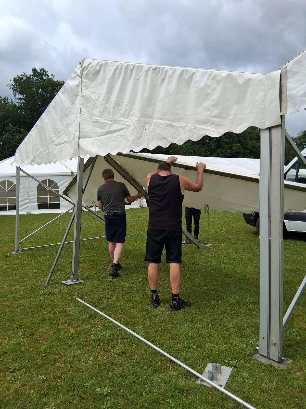 Occasions Marquees setting up marquee